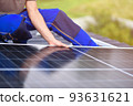 Process of installing solar panels on the roof of a house. Green energy. Rooftop solar power system 93631621