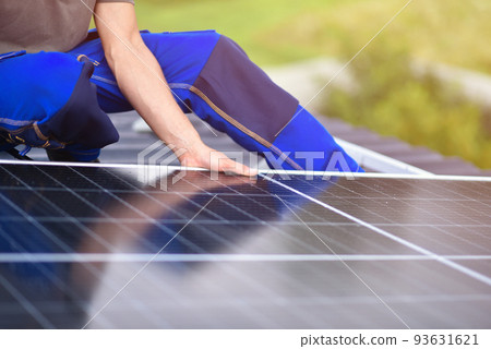 Process of installing solar panels on the roof of a house. Green energy. Rooftop solar power system 93631621