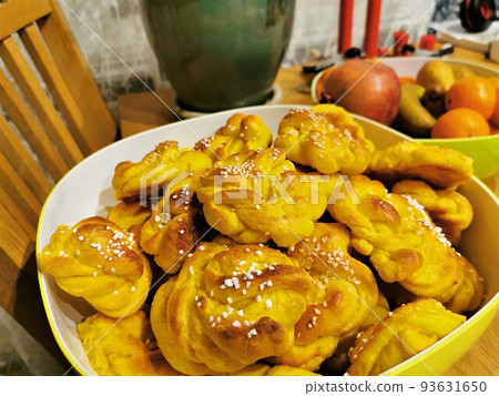 Saffron bun on kitchen background 93631650