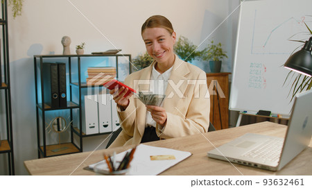 Rich business woman girl working on smartphone counting money cash, calculate earnings income profit Rich business woman girl working on smartphone counting money cash, calculate earnings income profit 93632461