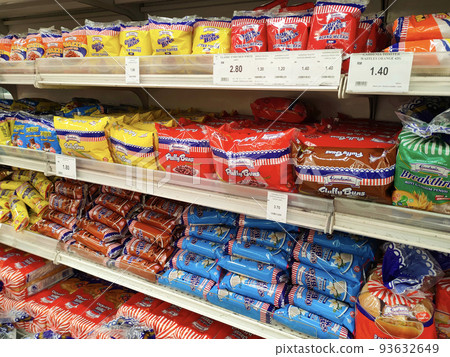 SEREMBAN, MALAYSIA -APRIL 28, 2020: Various types of bread in commercial packaging displayed on shelves for sale. Separated by type and brand to make it easier for customers to choose. SEREMBAN, MALAYSIA -APRIL 28, 2020: Various types of bread in commercial packaging displayed on shelves for sale. Separated by type and brand to make it easier for customers to choose. 93632649