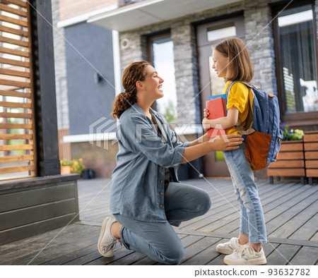 Parent and pupil going to school Parent and pupil going to school 93632782