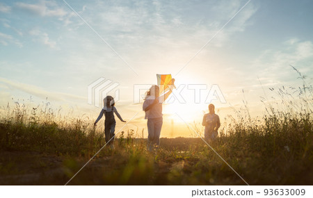 Happy family at sunset 93633009