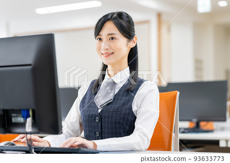 A business woman doing clerical work in the office 93633773