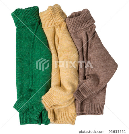 Three colored knitted sweaters lie next to each other, on a white background Three colored knitted sweaters lie next to each other, on a white background 93635331