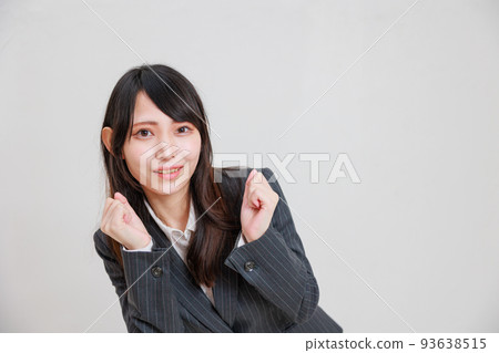 A woman cheering for the screen A woman cheering for the screen 93638515