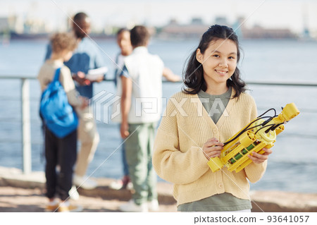 Smiling Girl in Outdoor Robotics Class 93641057