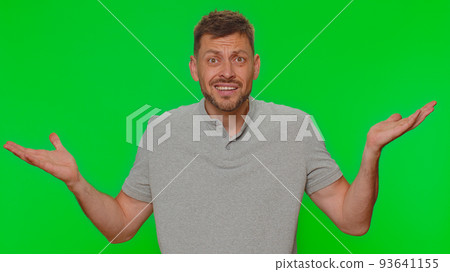 Handsome irritated man raising hands in indignant expression, asking why, what reason of failure Handsome irritated man raising hands in indignant expression, asking why, what reason of failure 93641155