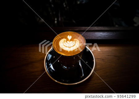 A cup of coffee latte top view with leaf shape foam A cup of coffee latte top view with leaf shape foam 93641299
