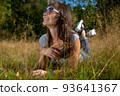 happy carefee young woman lies in grass in sunshining 93641367