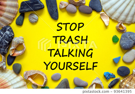 Stop trash talking yourself symbol. Concept words Stop trash talking yourself on a beautiful yellow background. Sea stones and seashells. Psychological and stop trash talking yourself concept. Copy Stop trash talking yourself symbol. Concept words Stop trash talking yourself on a beautiful yellow background. Sea stones and seashells. Psychological and stop trash talking yourself concept. Copy 93641395