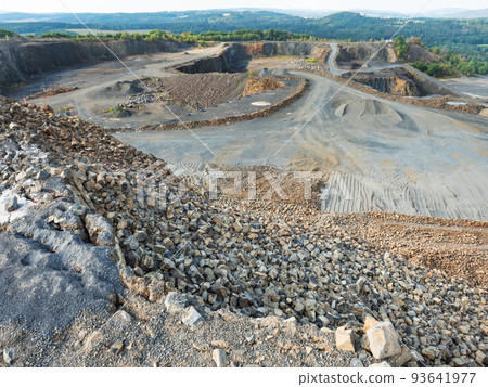 Basalt quarry. Marks of excavator operating in a rock quarry. Basalt quarry. Marks of excavator operating in a rock quarry. 93641977