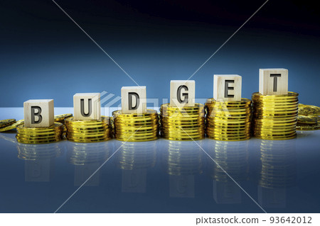 Budget text on wooden block with a pile of gold coins. Business concept. Budget text on wooden block with a pile of gold coins. Business concept. 93642012
