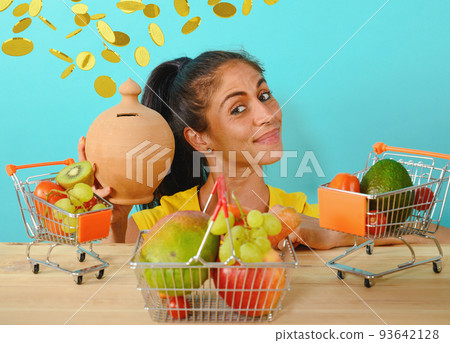Happy woman made a cheap and healthy shopping of fruit Happy woman made a cheap and healthy shopping of fruit 93642128