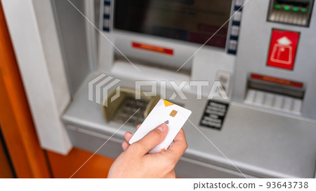 Atm cash machine. Money bank credit card holding hand. Withdraw money cash from atm. Money dollar, bank credit card. 93643738