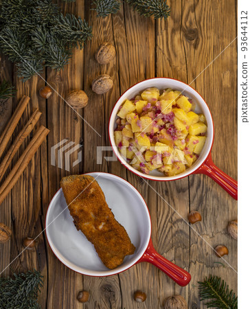Traditional Christmas dinner in Czech Republic - carp fillet with potato salad Traditional Christmas dinner in Czech Republic - carp fillet with potato salad 93644112