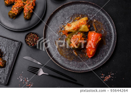 Dolma, stuffed grape leaves with rice and meat on a dark background 93644264
