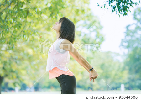 Women taking a deep breath during exercise Women taking a deep breath during exercise 93644500