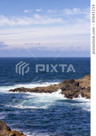 Rugged Rocks on a rocky shore on the West Coast of Pacific Ocean. Rugged Rocks on a rocky shore on the West Coast of Pacific Ocean. 93645154