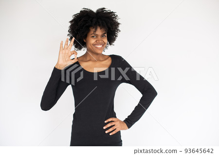 Portrait of happy African American woman showing ok gesture 93645642