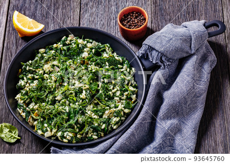 Spanakorizo, Greek spinach and rice pilaf in pan Spanakorizo, Greek spinach and rice pilaf in pan 93645760