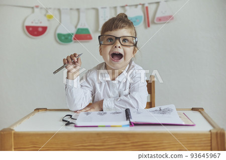 Charming child plays pretending to be a teacher Charming child plays pretending to be a teacher 93645967