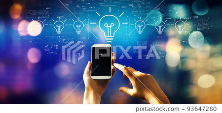 Idea light bulb theme with person using smartphone Idea light bulb theme with person using smartphone 93647280