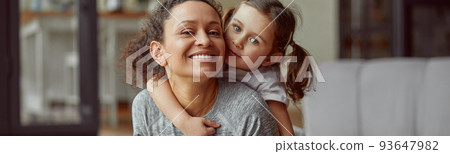 Joyful woman spending sporty day with daughter indoors 93647982