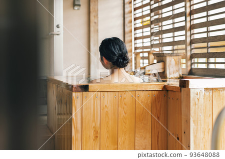 Image of a woman taking a cypress bath Image of a woman taking a cypress bath 93648088