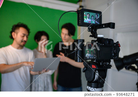 Director and actress confirming on set Blurred subject 93648271