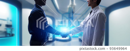 Engineers shaking hands in a future lab Horizontal visual for banners and advertisements 93649964
