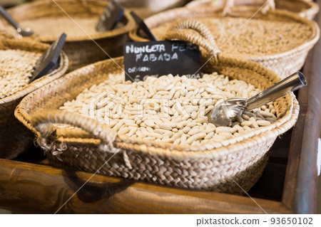 Fabada beans in wicker basket on shelf of store Fabada beans in wicker basket on shelf of store 93650102