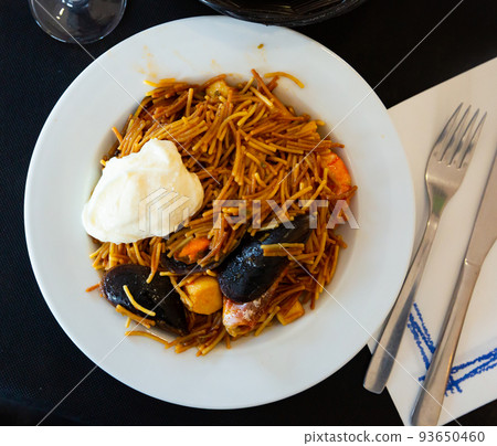 Image of paella noodles with prawns and shells Image of paella noodles with prawns and shells 93650460
