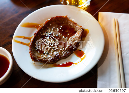 Veal steak with teriyaki sauce Veal steak with teriyaki sauce 93650597