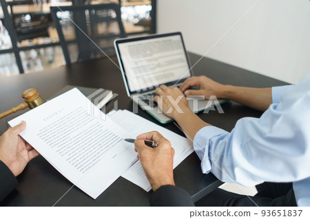 Lawyer and legal concept, Businessman typing on laptop as senior lawyer explain detail of contract Lawyer and legal concept, Businessman typing on laptop as senior lawyer explain detail of contract 93651837
