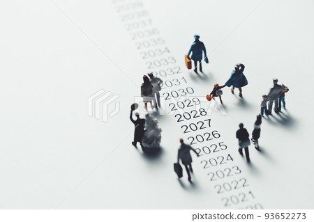 Miniature people walking beside chronology Miniature people walking beside chronology 93652273