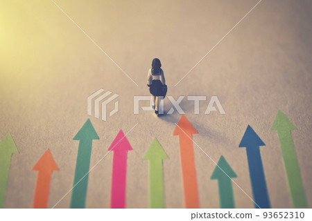 Miniature female student with colorful arrows 93652310