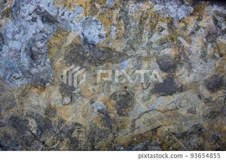 The texture of the stone is slate shot closeup of ordinary sandstone. The texture of the stone is slate shot closeup of ordinary sandstone. 93654855