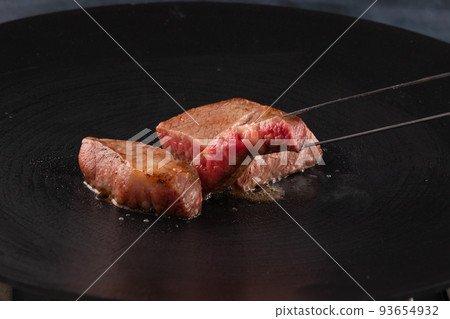 Lifting the beef tenderloin thick cut steak 93654932