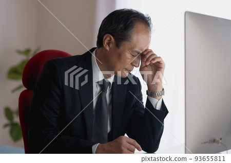 Middle man tired of desk work 93655811