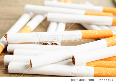 Cigarette, roll tobacco in paper with filter tube, No smoking concept. Cigarette, roll tobacco in paper with filter tube, No smoking concept. 93656395