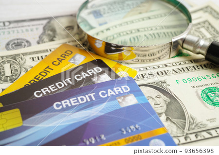 Credit card and magnifying glass for online shopping, security finance business concept. 93656398