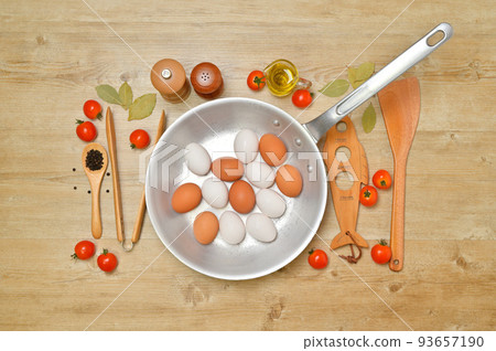 Image of cooking utensils. Aluminum frying pans, utensils, cooking, table. 93657190