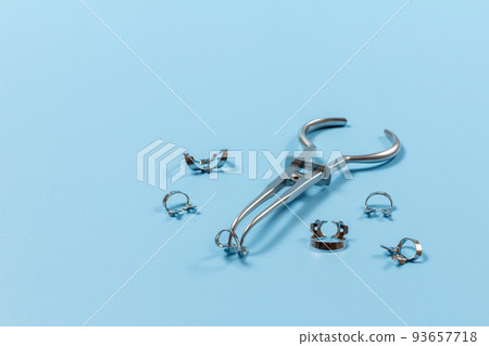 Rubber dam forceps and the clamps on blue Rubber dam forceps and the clamps on blue 93657718
