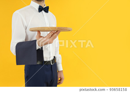 Concept of profession with young man waiter 93658158