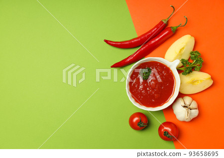 Concept of spicy sauce with Adjika, space for text Concept of spicy sauce with Adjika, space for text 93658695