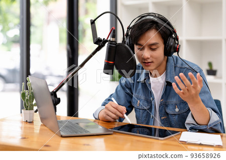 Man and woman podcasters interview each other for radio podcast 93658926