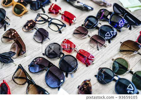 Vintage sunglasses on the counter of a flea market. Retro, fashion, vintage concept. 93659105