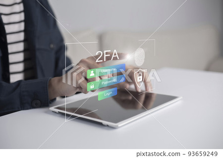 Businessman using tablet and touching virtual screen to fingerprint scan for two-factor authentication for safety use of social networks and access to information privacy Businessman using tablet and touching virtual screen to fingerprint scan for two-factor authentication for safety use of social networks and access to information privacy 93659249