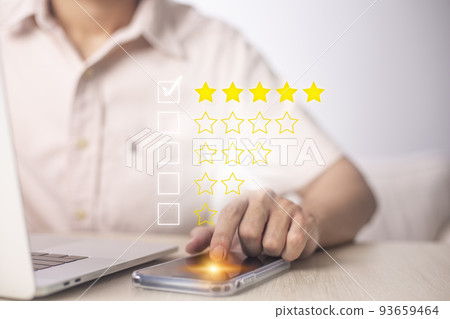 Satisfaction and customer service survey concept, business people using smartphone. to answer the questionnaire And the satisfaction rating, the satisfaction rating with the icon 5 stars. Satisfaction and customer service survey concept, business people using smartphone. to answer the questionnaire And the satisfaction rating, the satisfaction rating with the icon 5 stars. 93659464